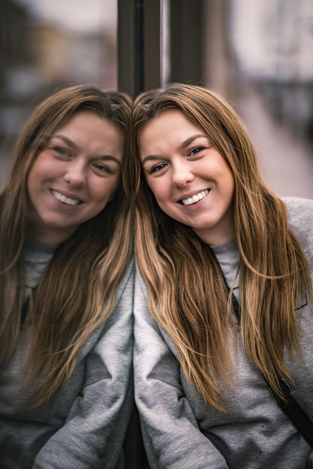 person smiling in mirror