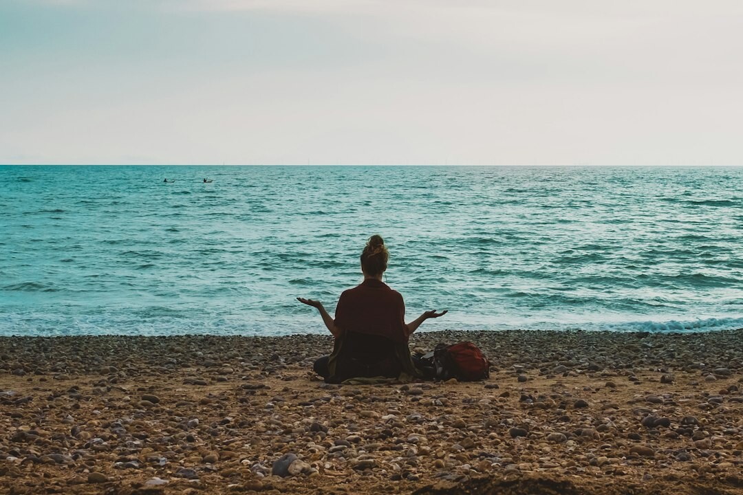 person meditating alone
