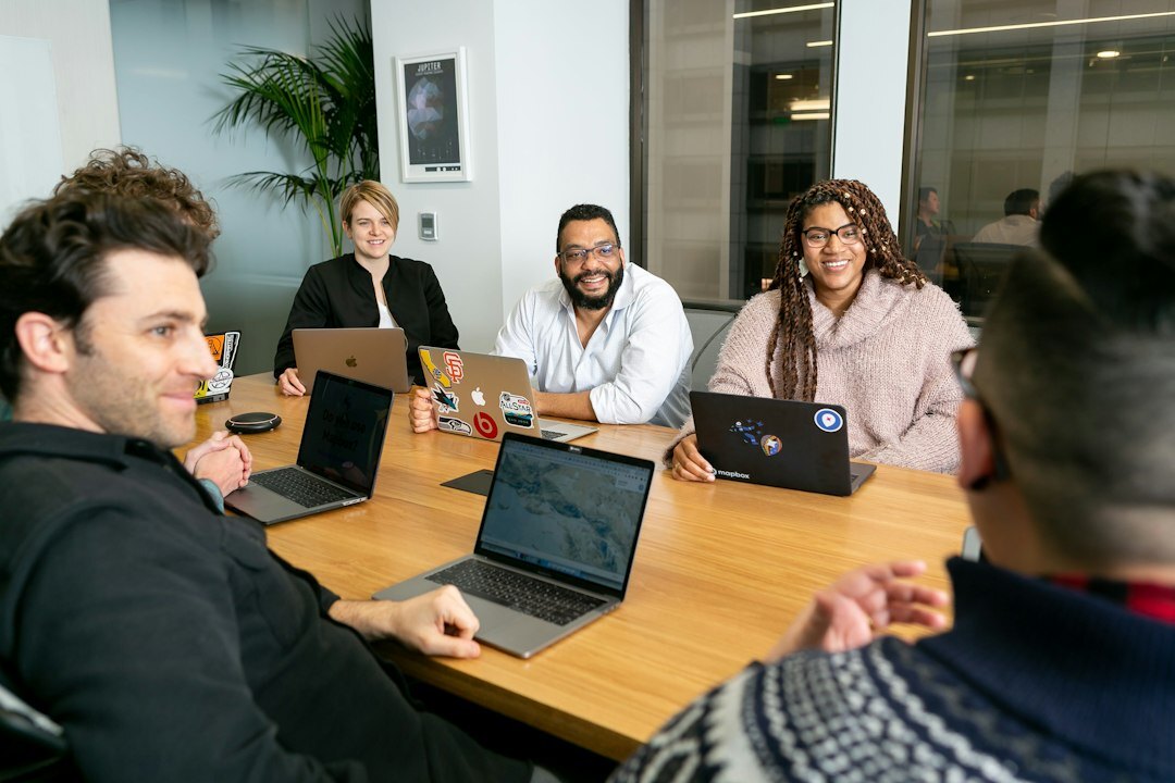 man leading team meeting