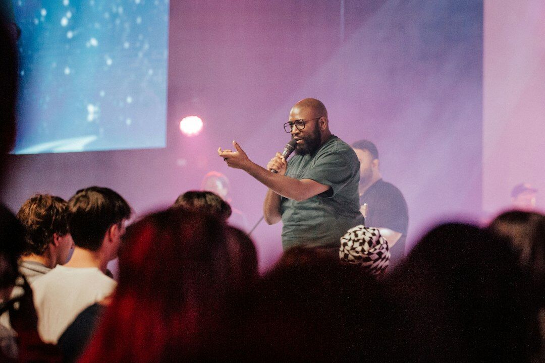 person giving speech on stage